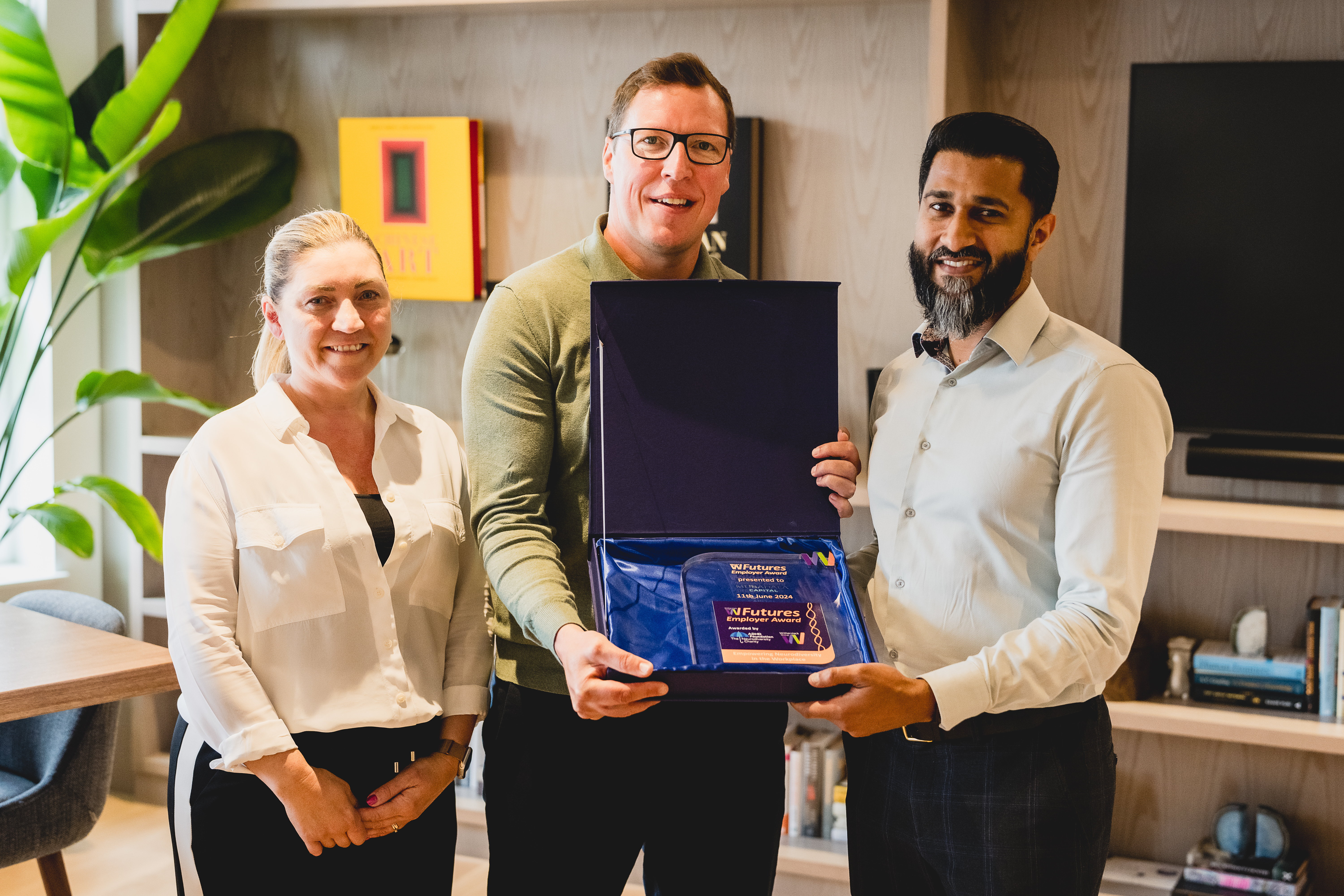 Head of Futures presenting the Futures Employer Award to Mubadala
